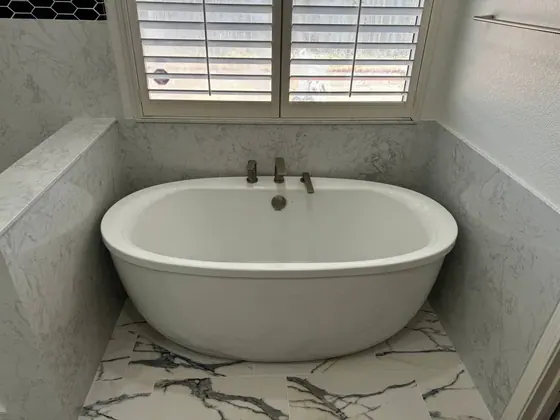 Bathroom Remodeling Project featuring bathtubs, tile & backsplashes — American Remodeling