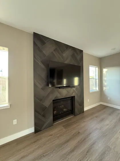 Fireplace Remodeling Project featuring tile & backsplashes — American Remodeling