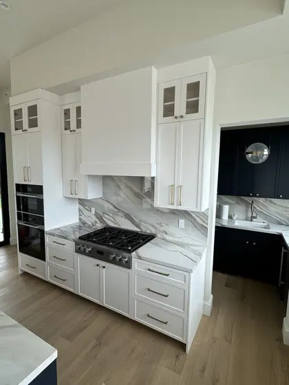 Kitchen Remodeling Project featuring tile & backsplashes, cabinets & storage — American Remodeling
