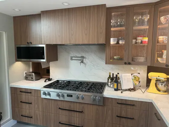Kitchen Remodeling Project featuring tile & backsplashes, cabinets & storage — American Remodeling
